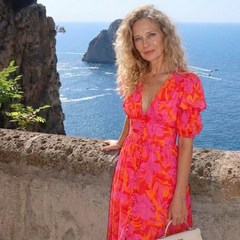 Willow floral V-neck puff sleeve midi dress by THE WHITMORE FAMILY, featuring a fitted waist and elegant midi length with floral print.