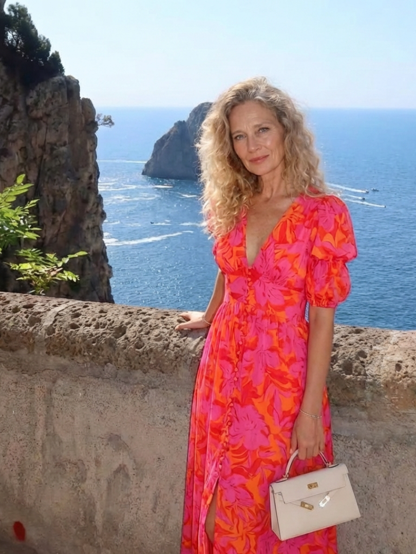 Willow floral V-neck puff sleeve midi dress by THE WHITMORE FAMILY, featuring a fitted waist and elegant midi length with floral print.