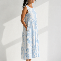 Multicolor Joy™ Leafy sleeveless midi dress from THE WHITMORE FAMILY, featuring a vibrant leafy pattern and midi length.