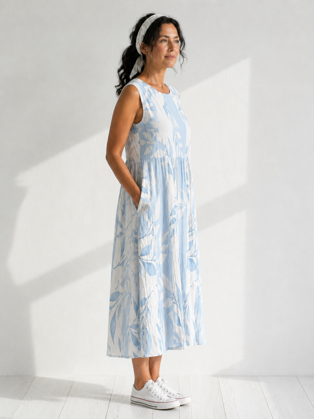 Multicolor Joy™ Leafy sleeveless midi dress from THE WHITMORE FAMILY, featuring a vibrant leafy pattern and midi length.