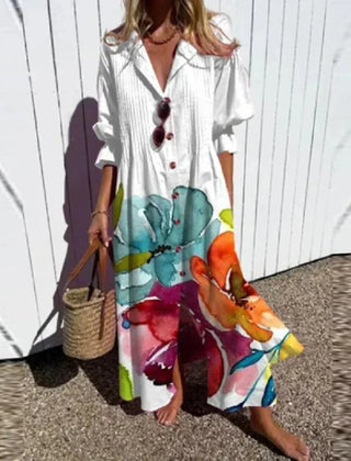 Multi-color Rimmey Beachcomber Boho Dress by THE WHITMORE FAMILY with flowing fabric and bohemian style, perfect for beachwear.