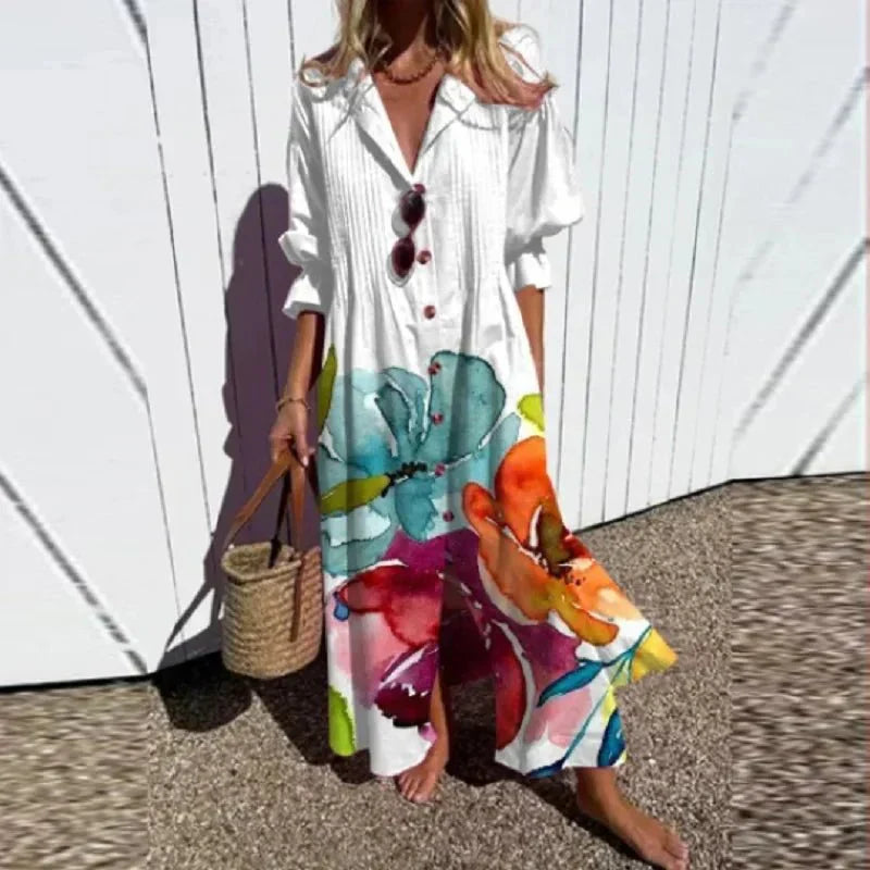 Multi-color Rimmey Beachcomber Boho Dress by THE WHITMORE FAMILY with flowing fabric and bohemian style, perfect for beachwear.