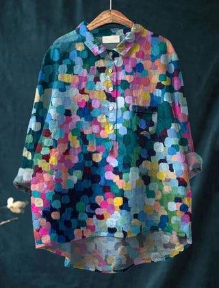 Colorful dot print shirt by THE WHITMORE FAMILY featuring vibrant multicolor dots on a lightweight fabric.