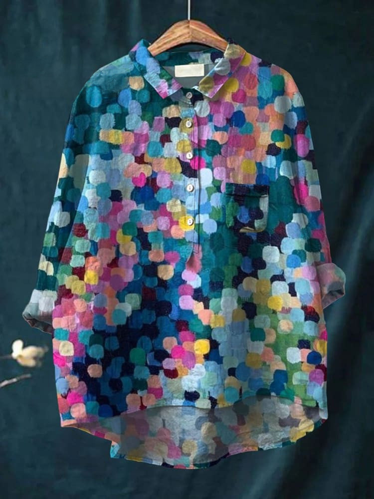 Colorful dot print shirt by THE WHITMORE FAMILY featuring vibrant multicolor dots on a lightweight fabric.