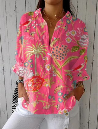Multicolor Chloe Tropical Blossom Blouse by THE WHITMORE FAMILY featuring vibrant floral print and lightweight fabric.