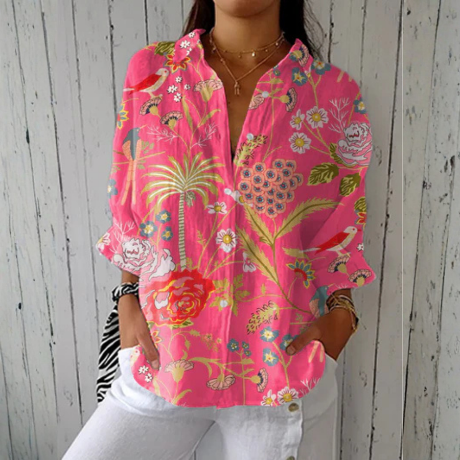 Multicolor Chloe Tropical Blossom Blouse by THE WHITMORE FAMILY featuring vibrant floral print and lightweight fabric.