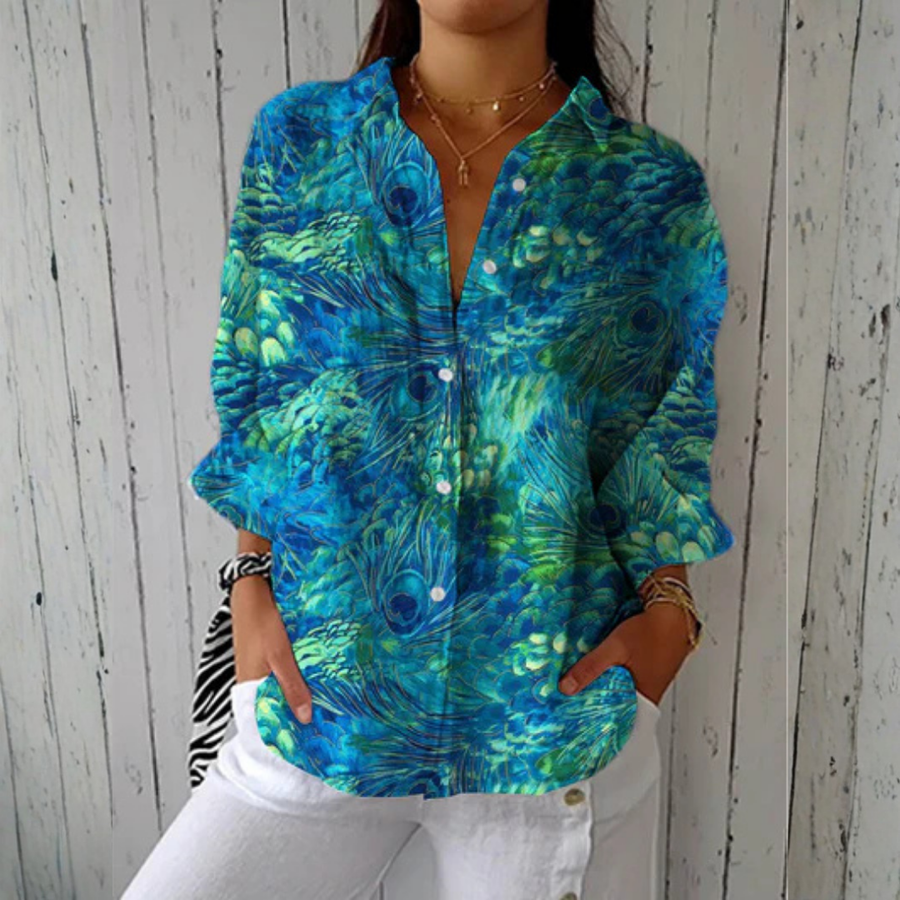 Multicolor Diana™ Peacock Grace Blouse by THE WHITMORE FAMILY featuring vibrant peacock feather-inspired fabric and stylish design.