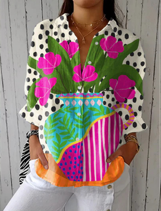 Donna™ Blooming Vase Blouse by THE WHITMORE FAMILY features multicolor floral patterns and lightweight fabric.
