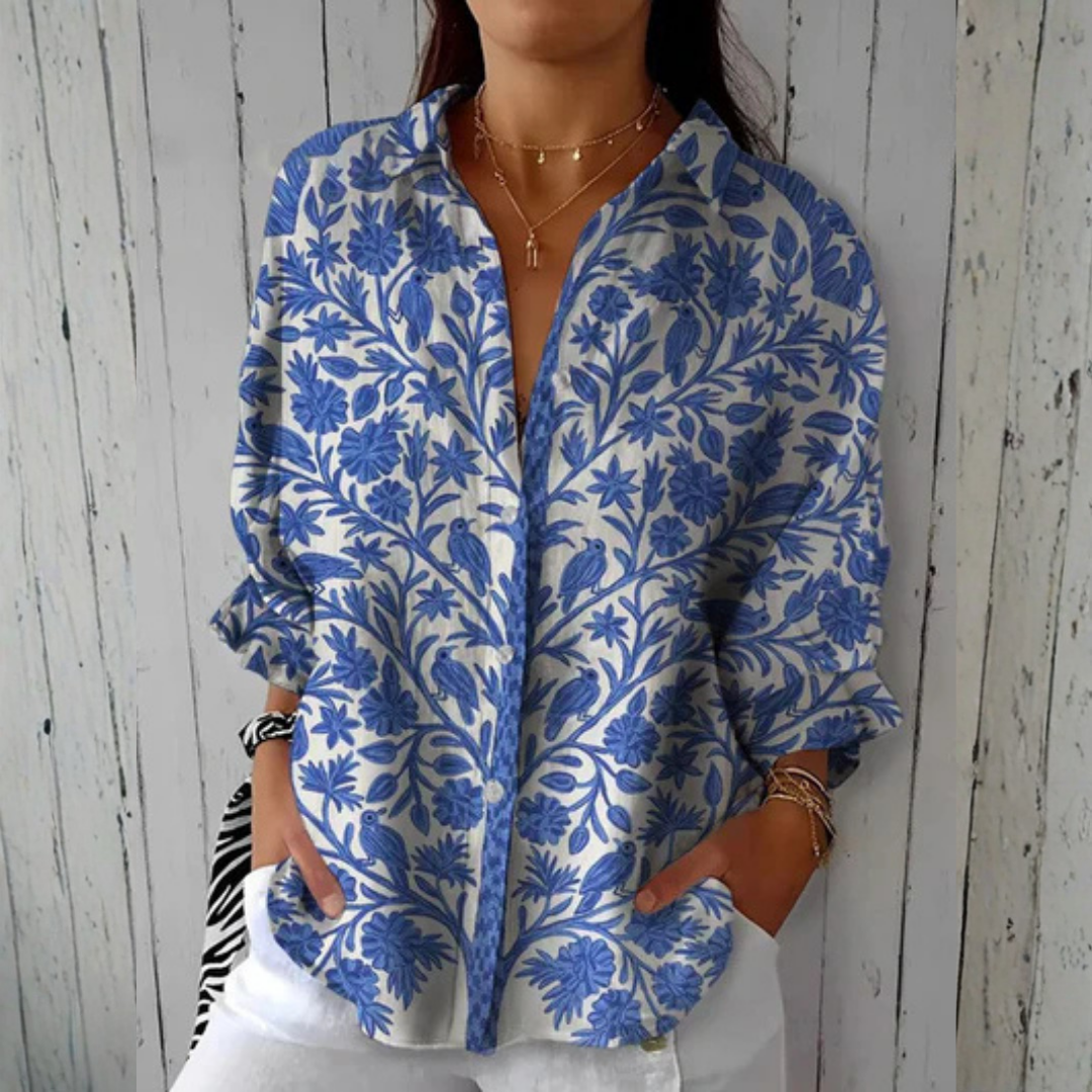 Isabelle™ Blue Garden Blouse by THE WHITMORE FAMILY featuring multicolor floral pattern and lightweight fabric.