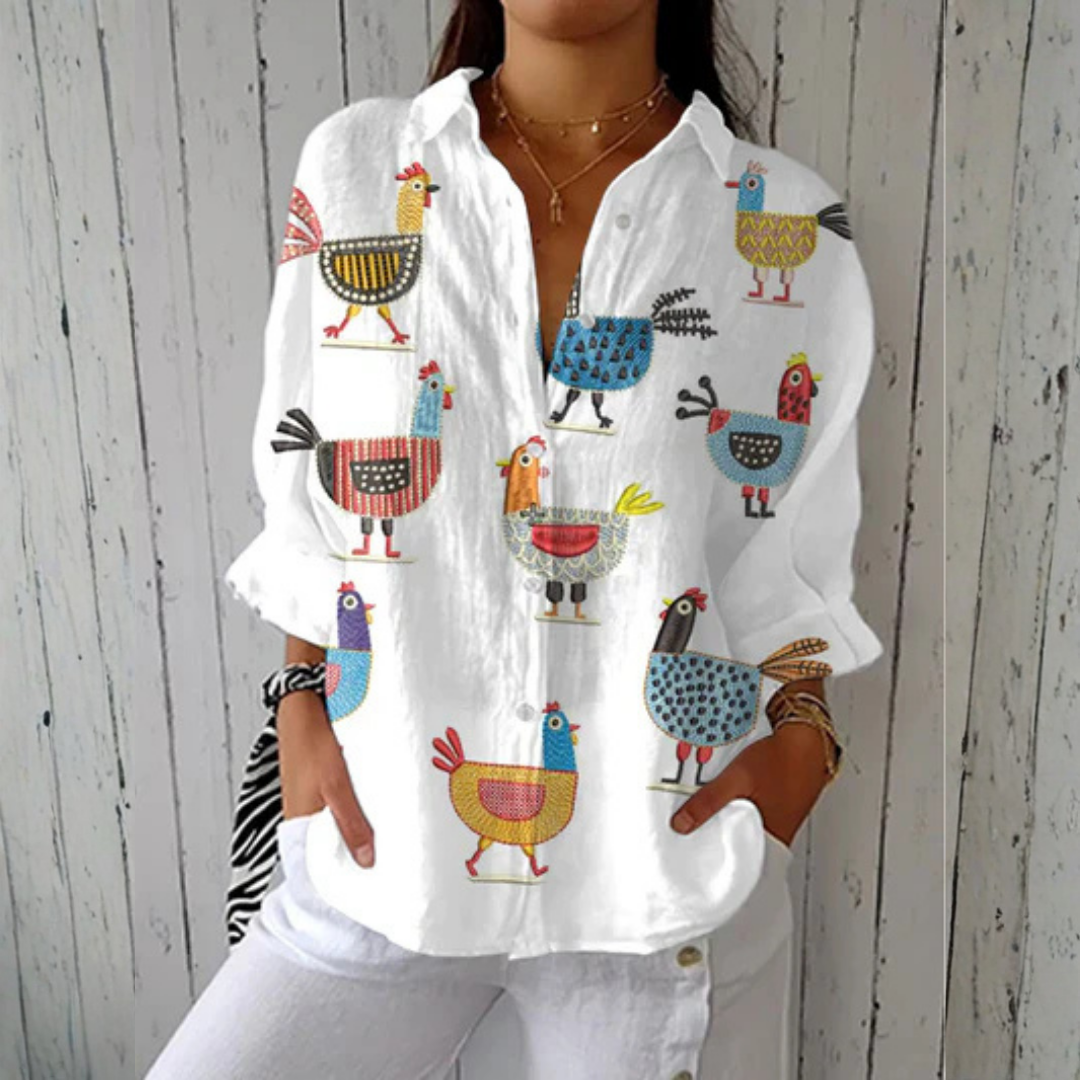 Kimberly™ Playful Hen Blouse by THE WHITMORE FAMILY featuring vibrant multicolor hen print and lightweight fabric.