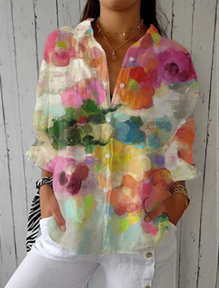 Multicolor Lily™ Watercolor Dreams blouse by THE WHITMORE FAMILY, featuring flowing fabric and vibrant watercolor print.