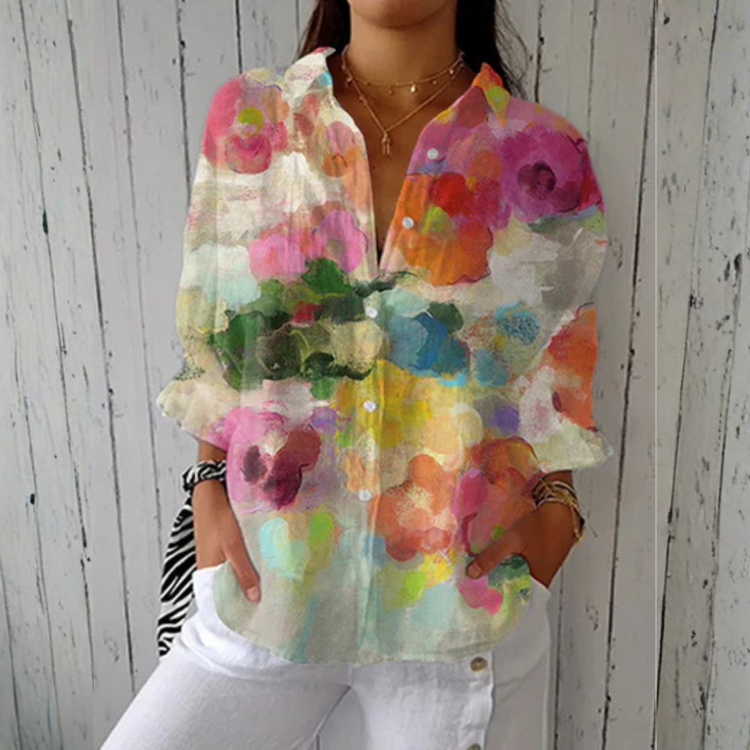 Multicolor Lily™ Watercolor Dreams blouse by THE WHITMORE FAMILY, featuring flowing fabric and vibrant watercolor print.