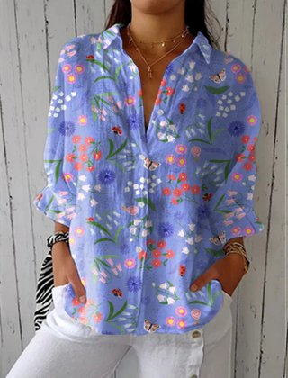 Louise™ Playful Dogs blouse by THE WHITMORE FAMILY features a colorful dog print on a stylish, casual women's blouse.
