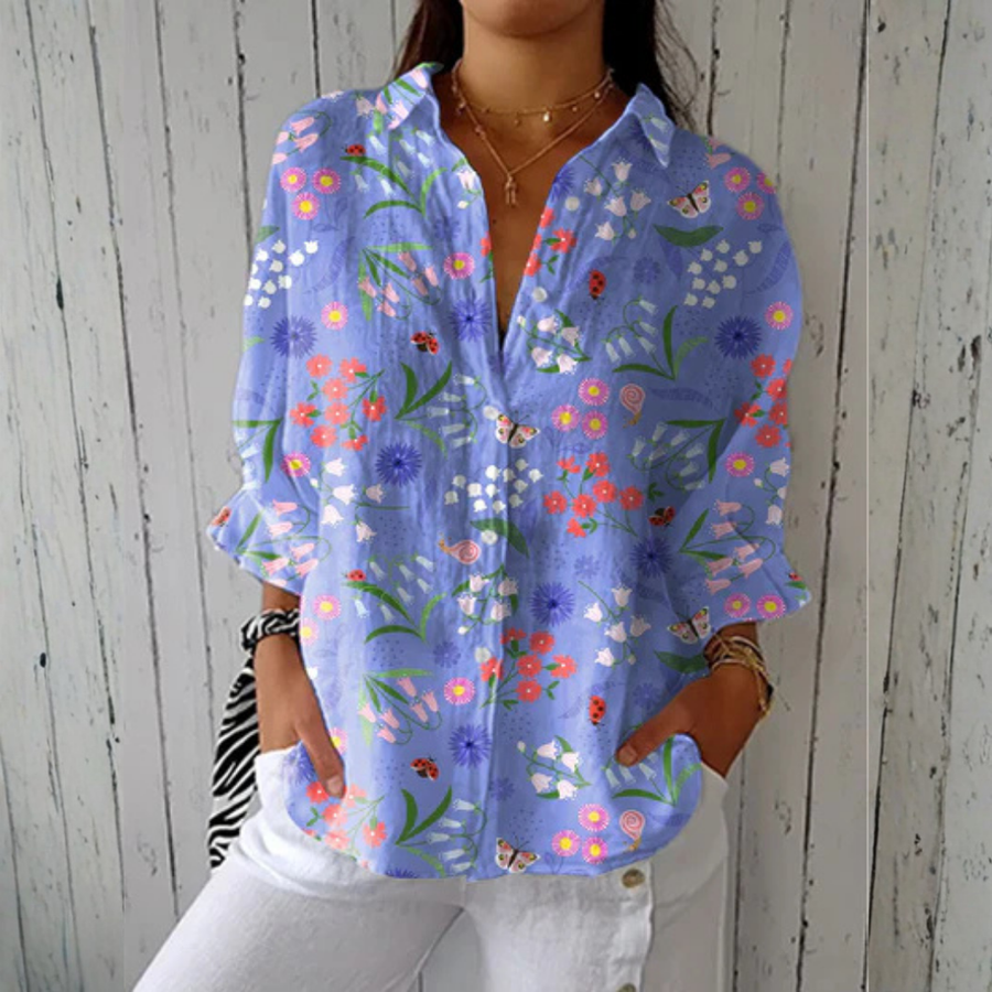 Louise™ Playful Dogs blouse by THE WHITMORE FAMILY features a colorful dog print on a stylish, casual women's blouse.