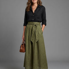 Vera two-piece set featuring a black blouse and olive green midi skirt by THE WHITMORE FAMILY, styled together on a model.