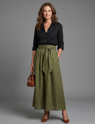 Vera two-piece set featuring a black blouse and olive green midi skirt by THE WHITMORE FAMILY, styled together on a model.