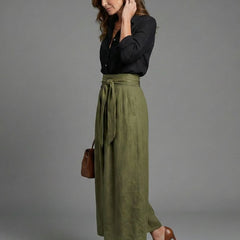 Vera two-piece set featuring a black blouse and olive green midi skirt from THE WHITMORE FAMILY. Stylish and coordinated outfit.