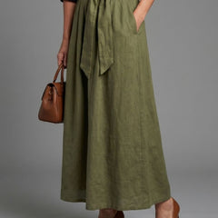Vera two-piece set featuring a black blouse and olive green midi skirt by THE WHITMORE FAMILY, styled for a fashionable look.