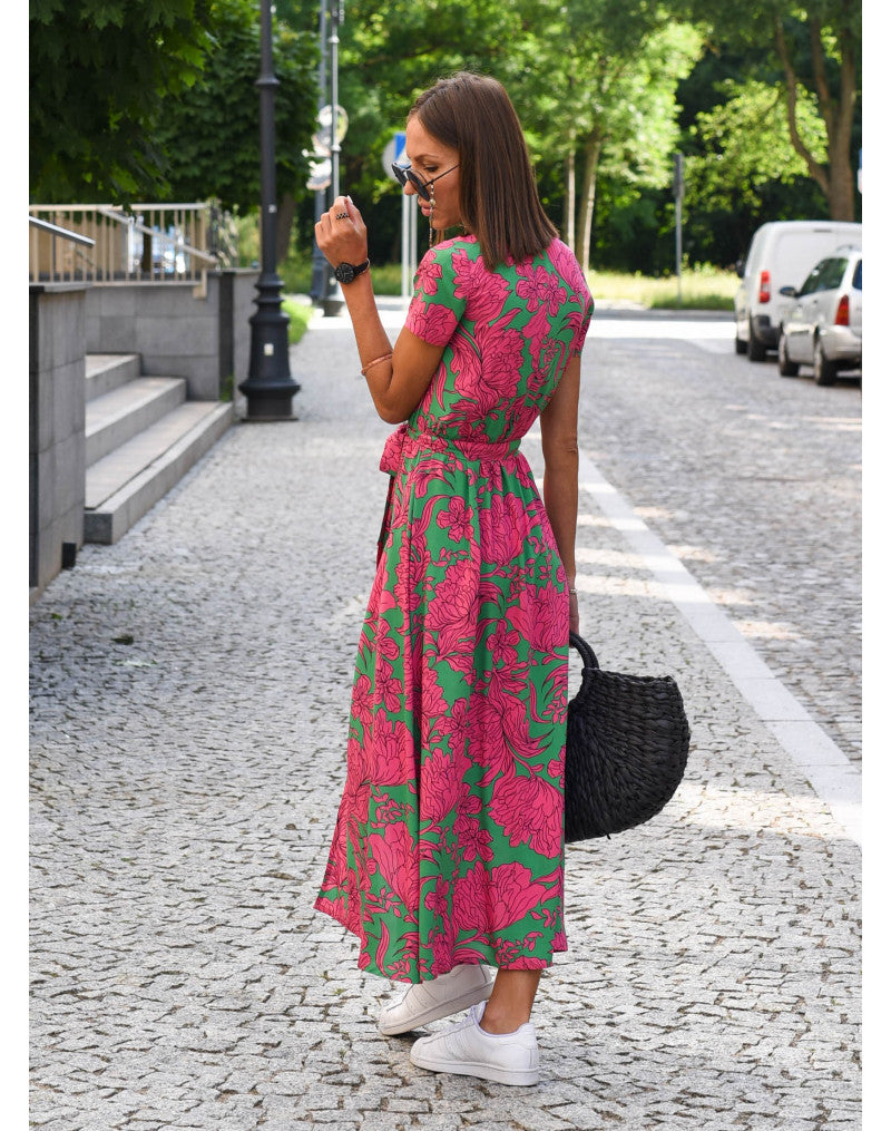 Multicolored floral V-neck dress by THE WHITMORE FAMILY, featuring a stylish design and lightweight fabric.