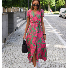 Multicolored floral V-neck dress by THE WHITMORE FAMILY, featuring a stylish and elegant design perfect for casual or formal wear.