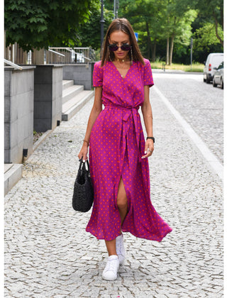 Multicolored floral V-neck dress named Judy by THE WHITMORE FAMILY, featuring a stylish design and vibrant pattern.
