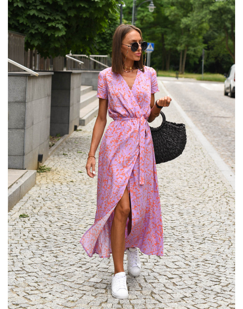 Multicolored Judy stylish V-neck floral dress by THE WHITMORE FAMILY, featuring a vibrant floral pattern and a flattering V-neckline.