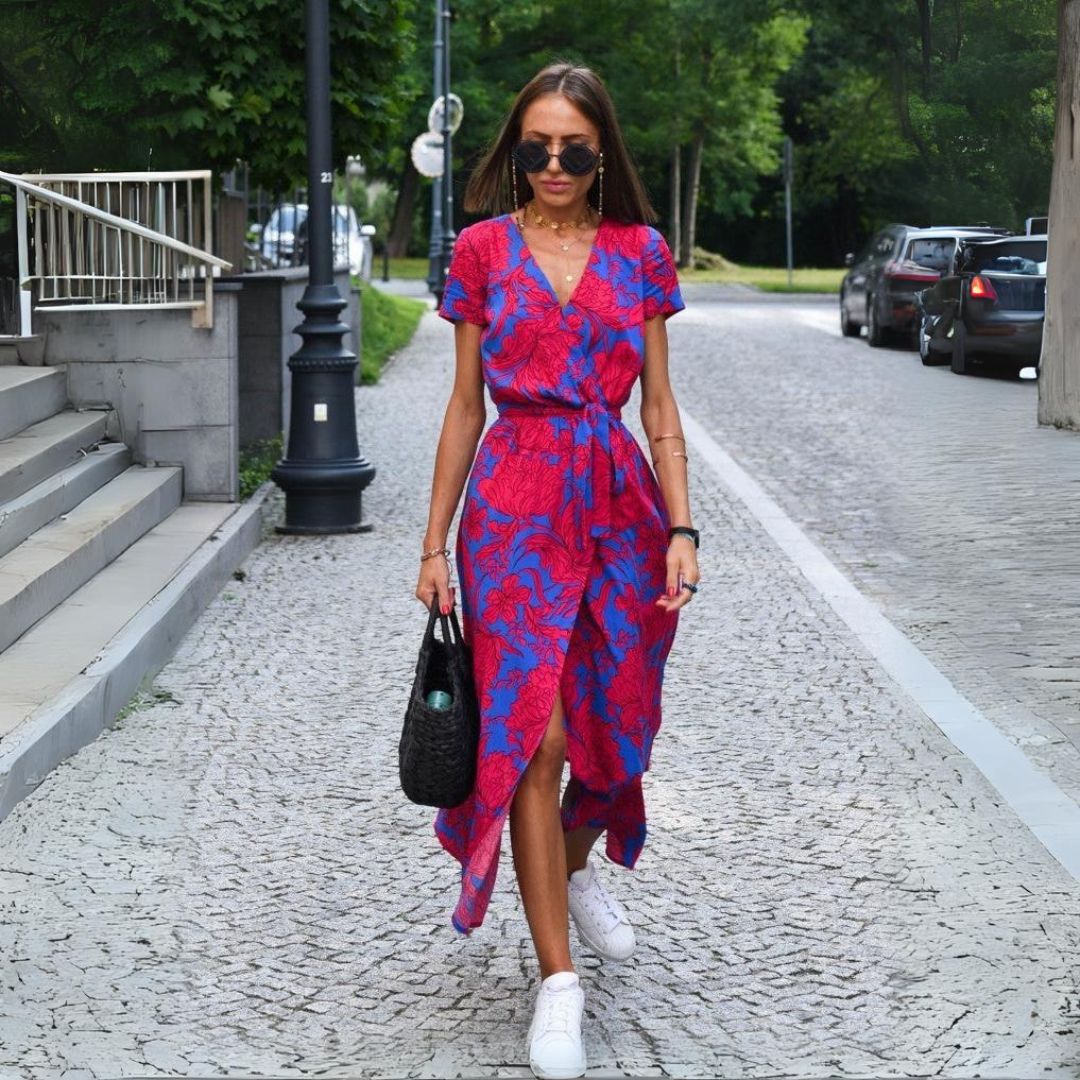 Multicolored floral V-neck dress by THE WHITMORE FAMILY, featuring a stylish design and flowing fabric.
