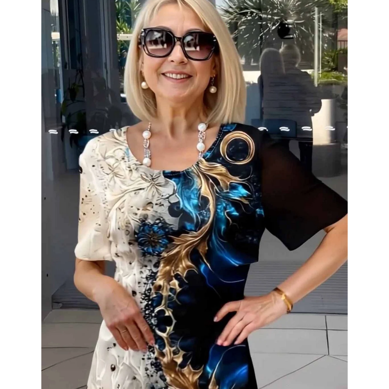 Navy printed Viviana relaxed dress by THE WHITMORE FAMILY, with flowy fabric and casual style, displayed on a model.