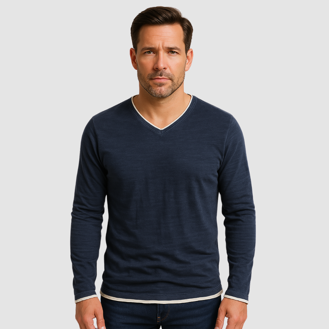 Navy blue Kaido™ cotton long sleeve shirt by THE WHITMORE FAMILY, displayed on a hanger with a close-up of fabric and button details.