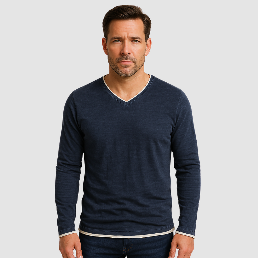 Navy blue Kaido™ cotton long sleeve shirt by THE WHITMORE FAMILY, displayed on a hanger with a close-up of fabric and button details.