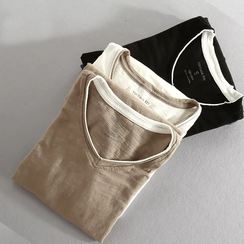 Navy blue Kaido™ Cotton Long Sleeve Shirt by THE WHITMORE FAMILY, shown on a hanger with a close-up of fabric and collar details.