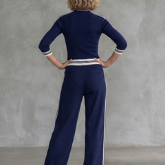 Navy Eirlys fitted long sleeve top and wide-leg pants set by THE WHITMORE FAMILY displayed on a model.
