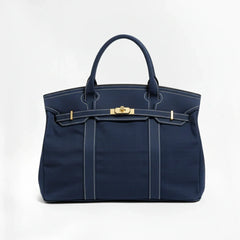 Navy blue Camille Boat Tote by THE WHITMORE FAMILY with sturdy handles and spacious interior for everyday use.