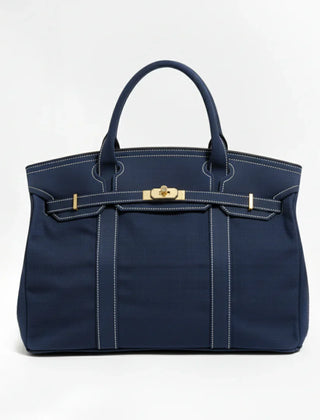 Navy blue Camille Boat Tote by THE WHITMORE FAMILY with sturdy handles and spacious interior for everyday use.