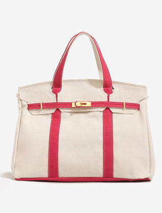 The Camille Boat Tote by THE WHITMORE FAMILY, beige canvas tote bag with leather handles and nautical stripe interior.