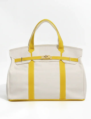 Sunny yellow Camille Boat Tote by THE WHITMORE FAMILY with sturdy handles and spacious interior for everyday use.