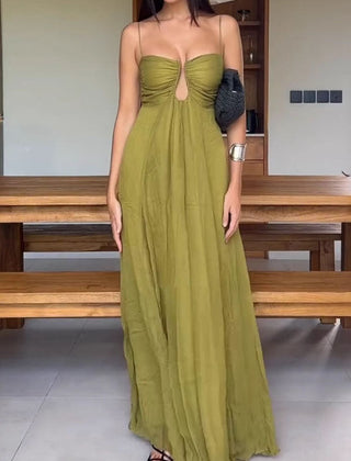 Stylish green guest dress by THE WHITMORE FAMILY with elegant design, perfect for formal events and gatherings.
