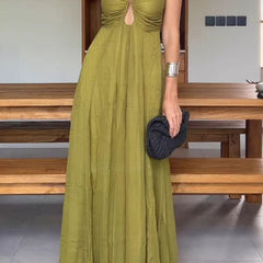 Stylish green guest dress by THE WHITMORE FAMILY, featuring a fitted silhouette and elegant design for special occasions.