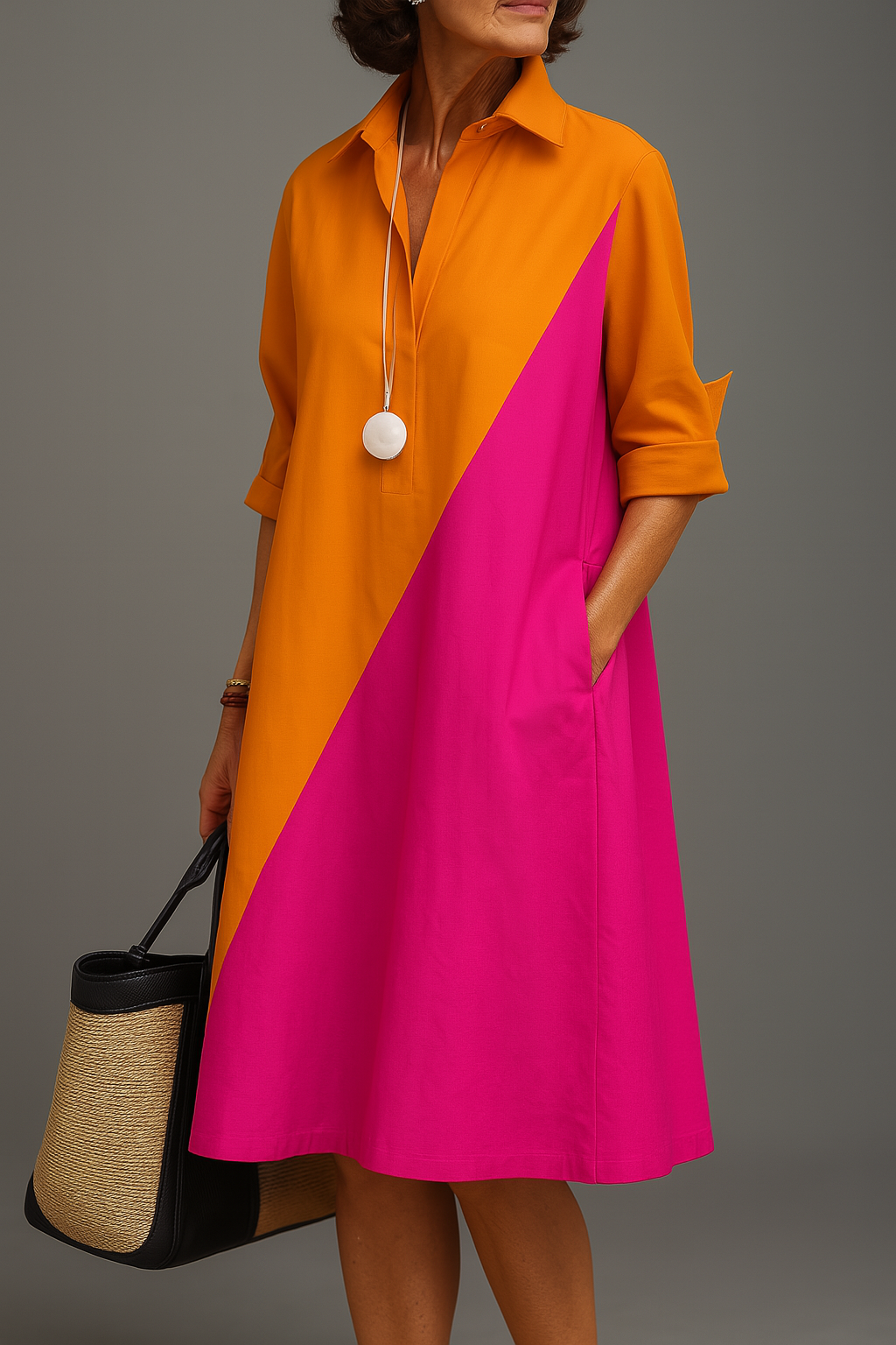 Orange and pink Kayla™ comfortable midi dress by THE WHITMORE FAMILY, flowing fabric and stylish design, shown on a model.