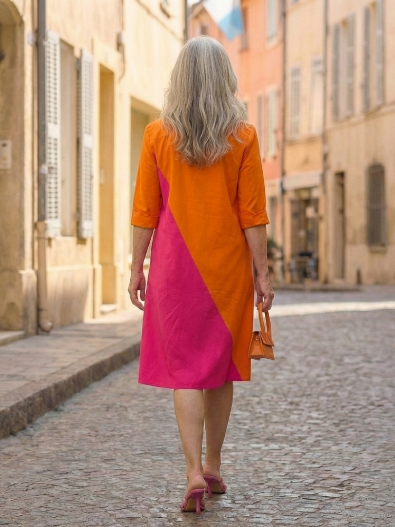 Orange Cassia Easy Morning Dress by THE WHITMORE FAMILY, showcasing a comfortable, stylish casual dress with flowing fabric and relaxed fit.