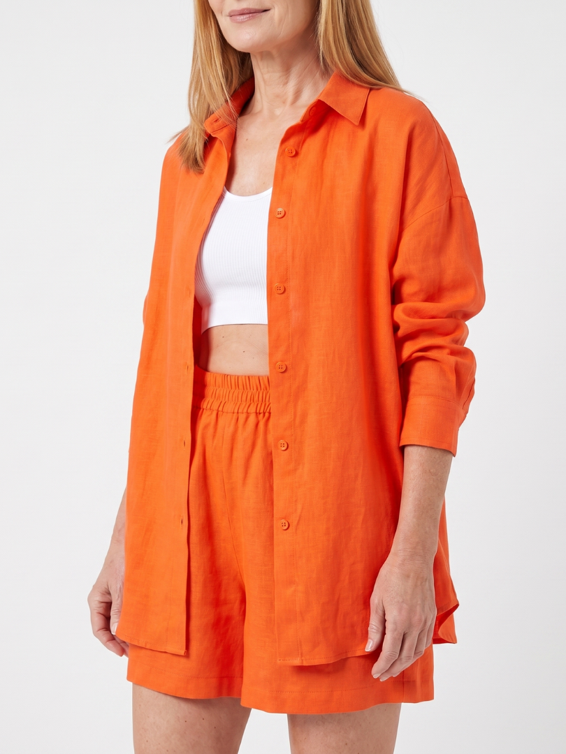 Orange Philomena cropped camisole and wide-leg pants set by THE WHITMORE FAMILY, styled together in a coordinated fashion.