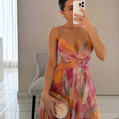 Grace Romantic Invisible Dress by THE WHITMORE FAMILY, orange color, lightweight fabric, close-up of the elegant dress on hanger