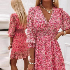 Pink floral dress from THE WHITMORE FAMILY's Sunna collection, featuring elegant design and delicate flower patterns.