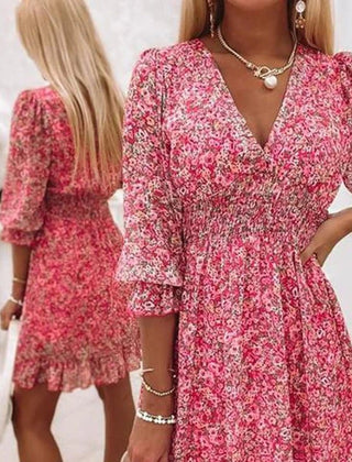 Pink floral dress from THE WHITMORE FAMILY's Sunna collection, featuring elegant design and delicate flower patterns.