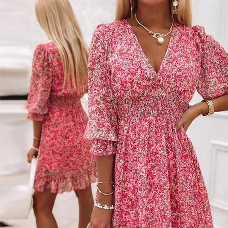 Pink floral dress from THE WHITMORE FAMILY's Sunna collection, featuring elegant design and delicate flower patterns.