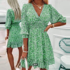 Pink Sunna Elegant Floral Dress by THE WHITMORE FAMILY, featuring intricate floral patterns and a flowing, sophisticated design.