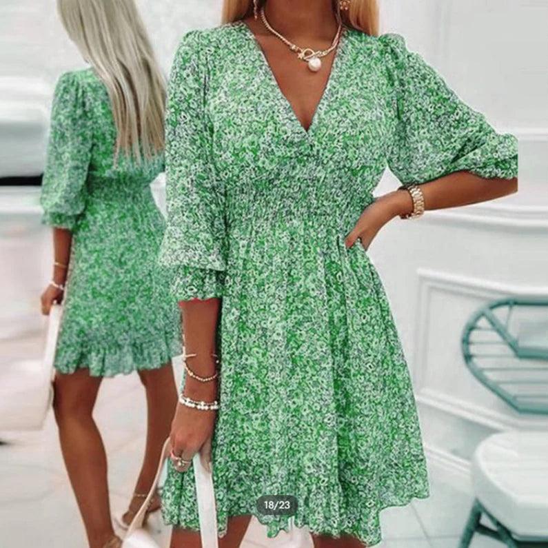 Pink Sunna Elegant Floral Dress by THE WHITMORE FAMILY, featuring intricate floral patterns and a flowing, sophisticated design.