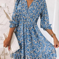 Pink Sunna Elegant Floral Dress by THE WHITMORE FAMILY, featuring a flowy design and delicate floral pattern.