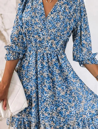 Pink Sunna Elegant Floral Dress by THE WHITMORE FAMILY, featuring a flowy design and delicate floral pattern.