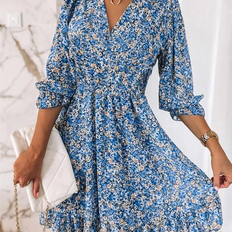 Pink Sunna Elegant Floral Dress by THE WHITMORE FAMILY, featuring a flowy design and delicate floral pattern.